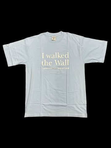 Light blue t-shirt with white I walked the wall text on